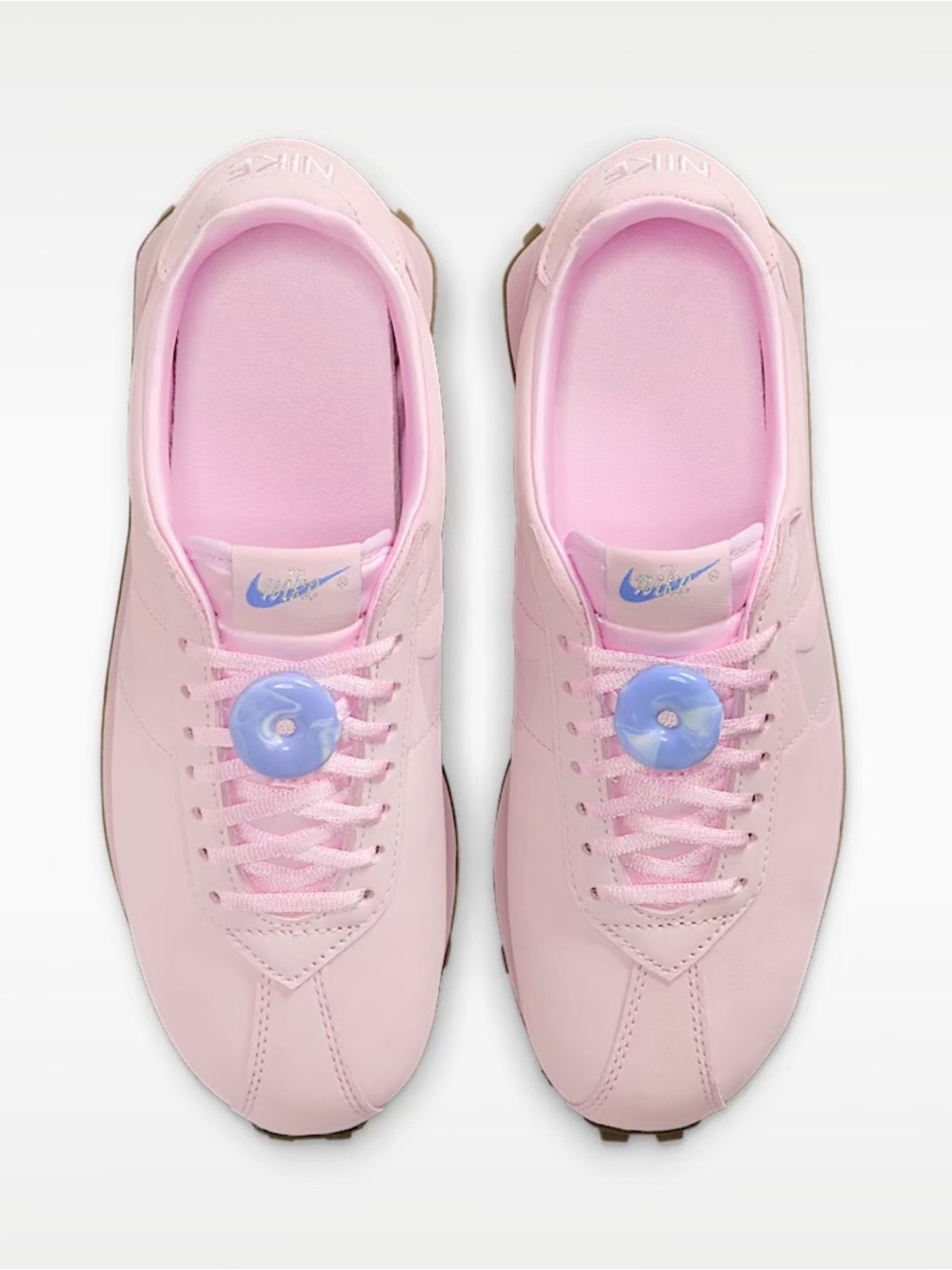 Nike Women's Pastel Pink Sneakers with Lavender Accents